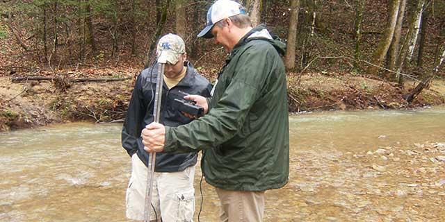 Photo of Chris Barton and forestry student